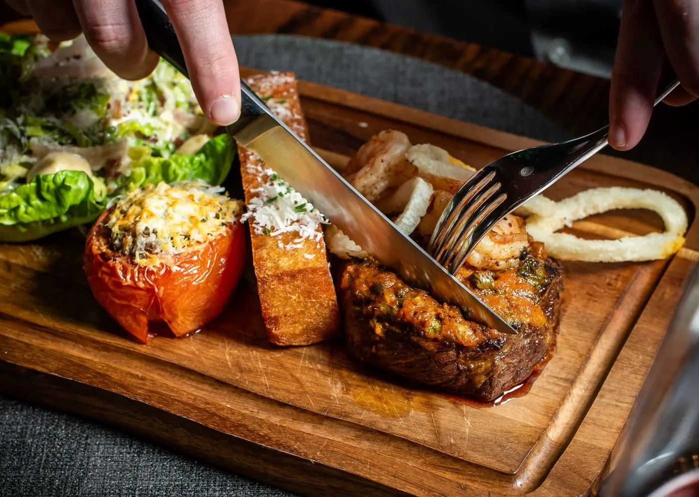 Cutting into chef alex's surf and turf at Larder